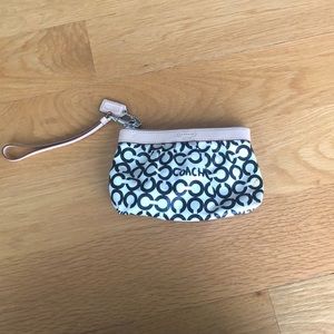 White and black Coach wristlet